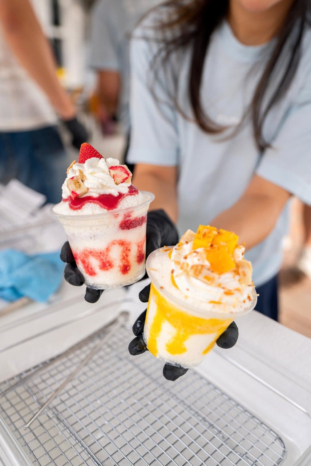 Strawberry and mango Snow° cups served at an event