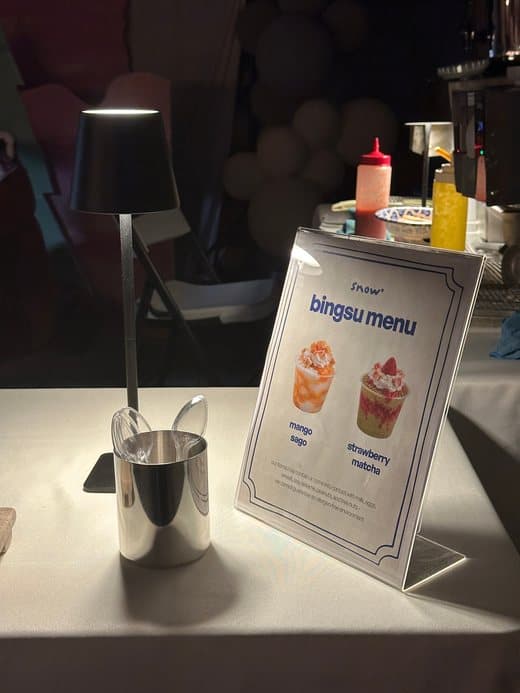 Bingsu menu sign on a table at night