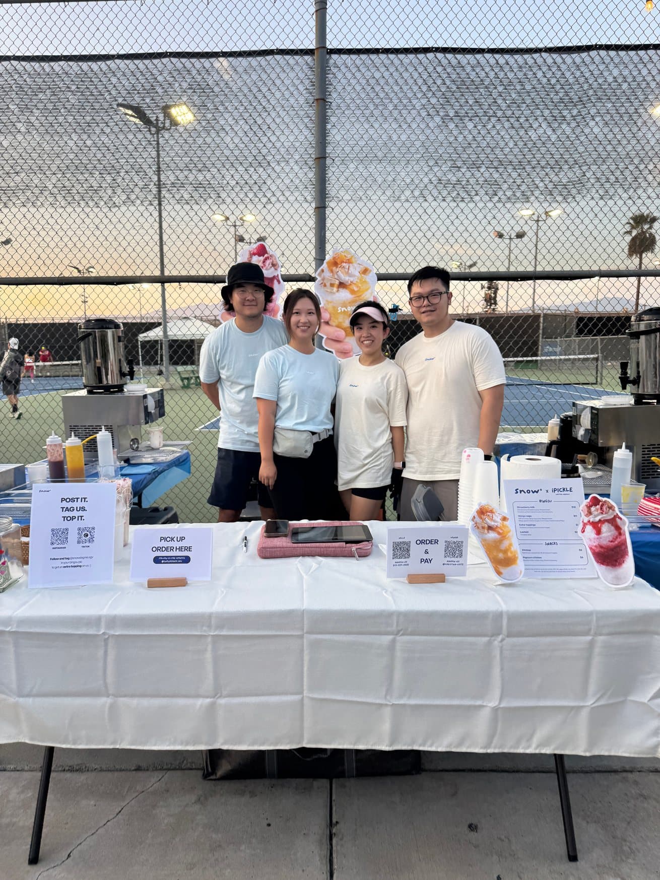The Snow° team at their pop-up table